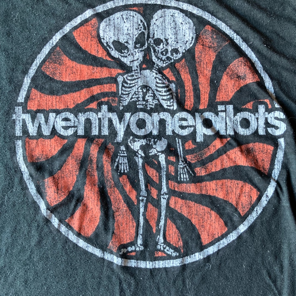 Twenty One Pilots band t-shirt.